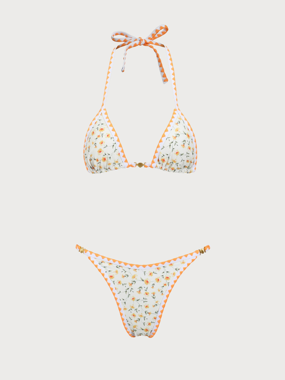 Gelbes Bikini-Set mit Blumenmuster und kontrastierenden Zähnen